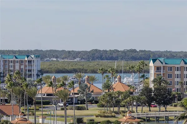 a view of a room with wooden floor and fan