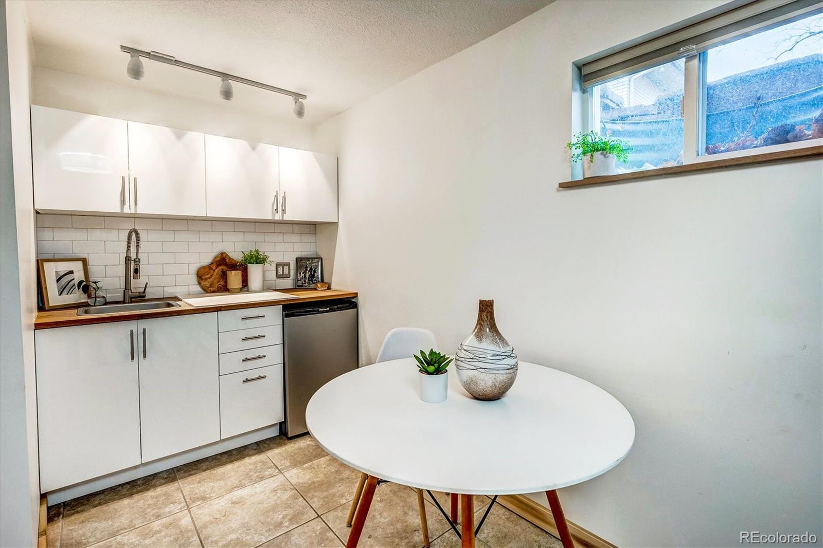 4615 Gordon Drive Boulder, CO 80305 - Photo 21 of 27 a kitchen with a sink a stove and a window