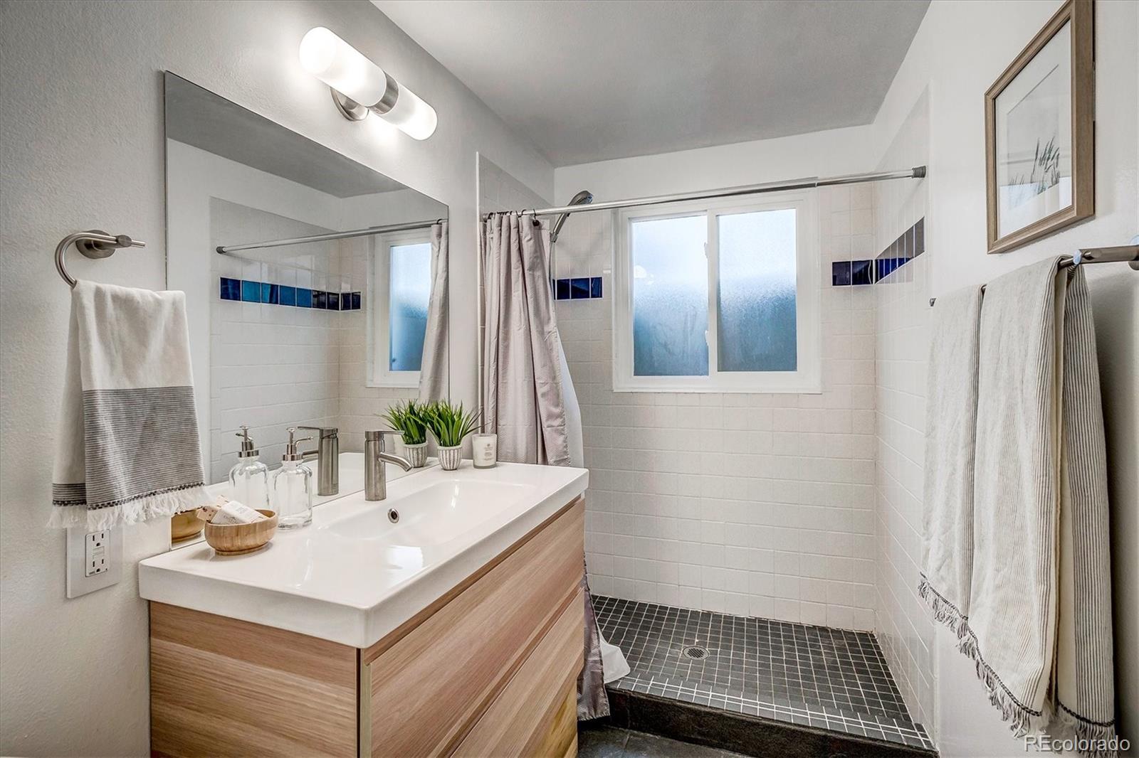 4615 Gordon Drive Boulder, CO 80305 - Photo 24 of 27 a bathroom with a sink toilet and shower