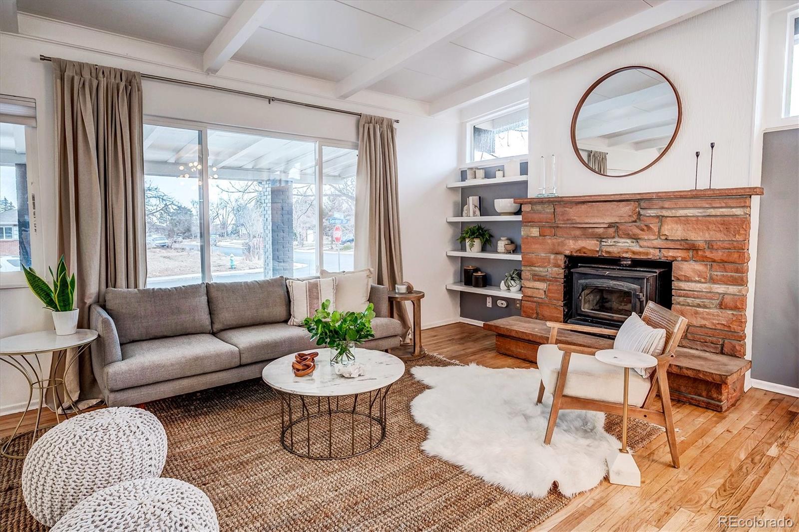 4615 Gordon Drive Boulder, CO 80305 - Photo 5 of 27 a living room with furniture a fireplace a rug and a large window