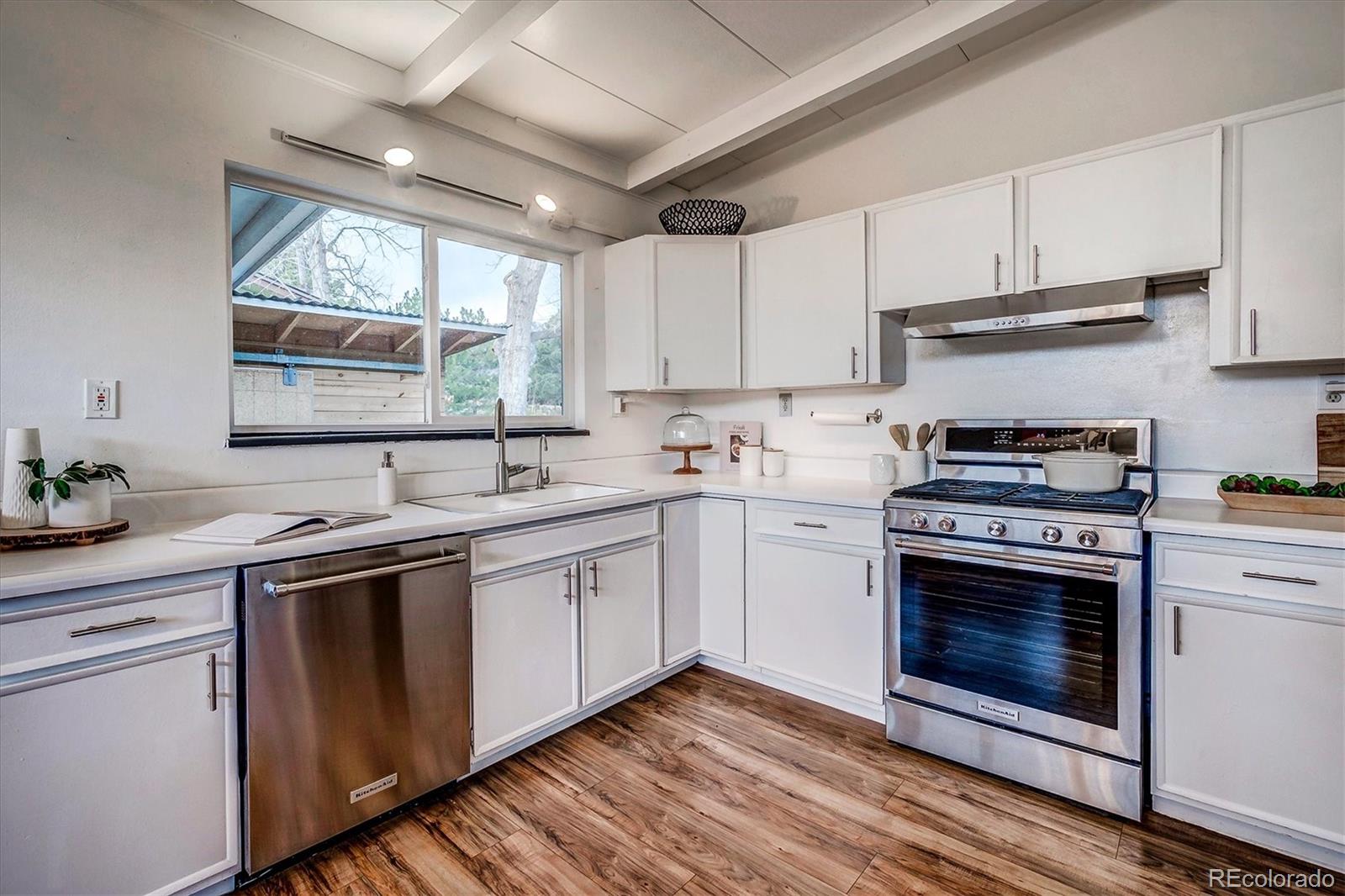 4615 Gordon Drive Boulder, CO 80305 - Photo 10 of 27 a kitchen with a sink stove and cabinets