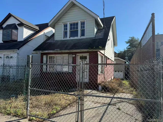 a house that has a tree in front of it