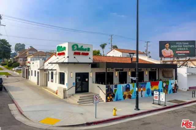 a view of a living room with a lot of people