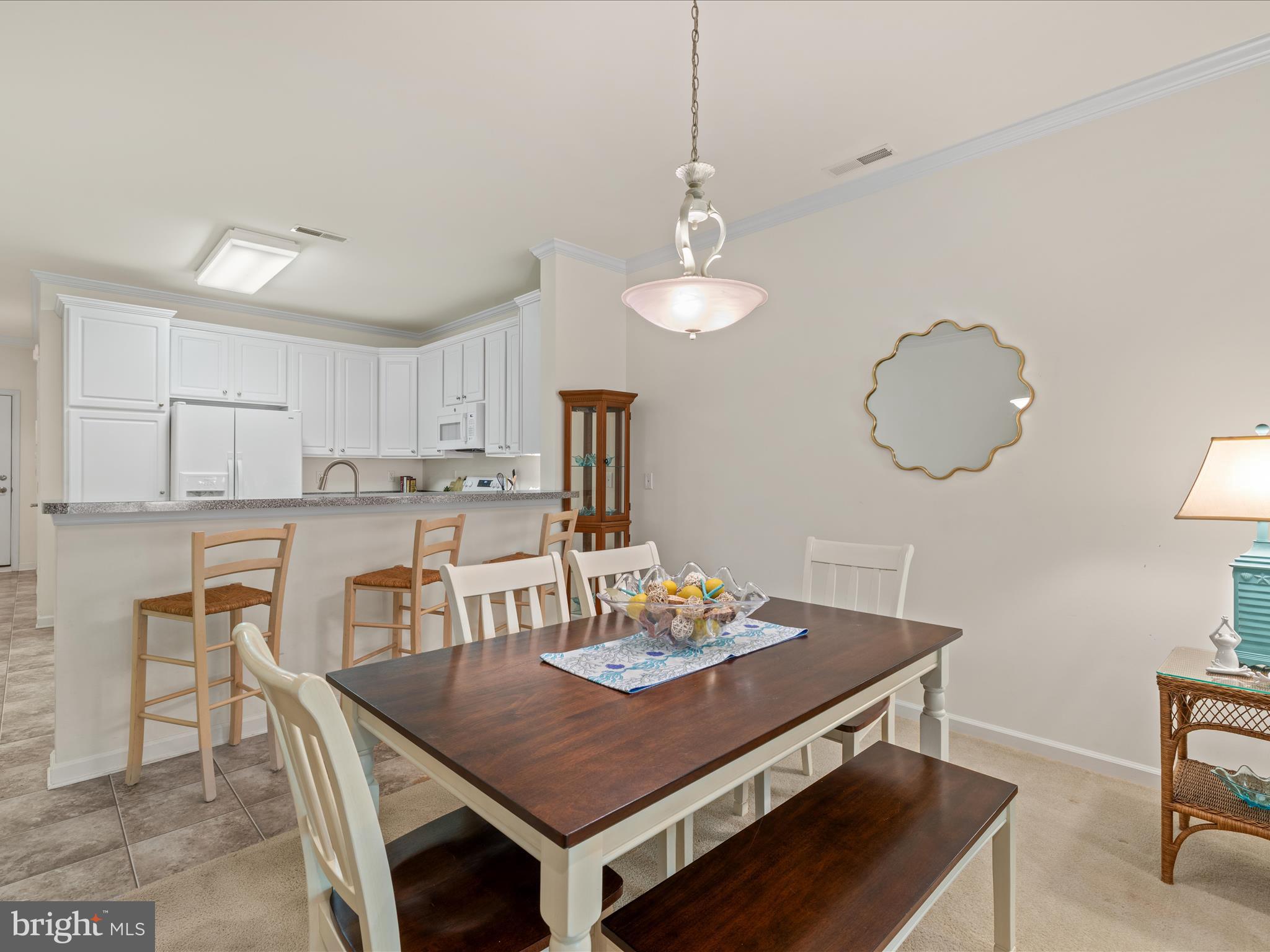 30413 Cedar Neck Road, Unit 304 Ocean View, DE 19970 - Photo 12 of 46 a view of a dining room and livingroom