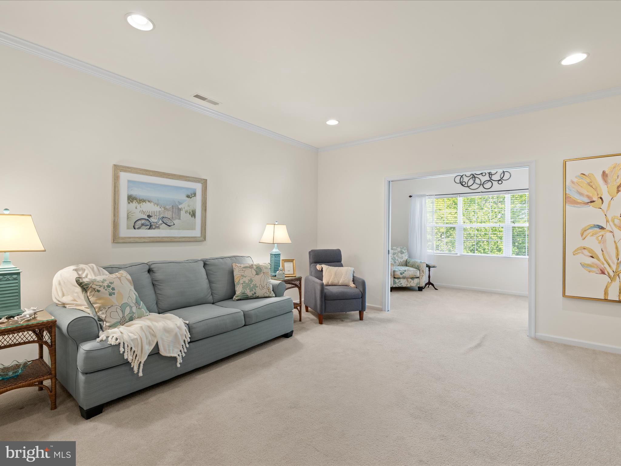 30413 Cedar Neck Road, Unit 304 Ocean View, DE 19970 - Photo 14 of 46 a living room with furniture and a large window