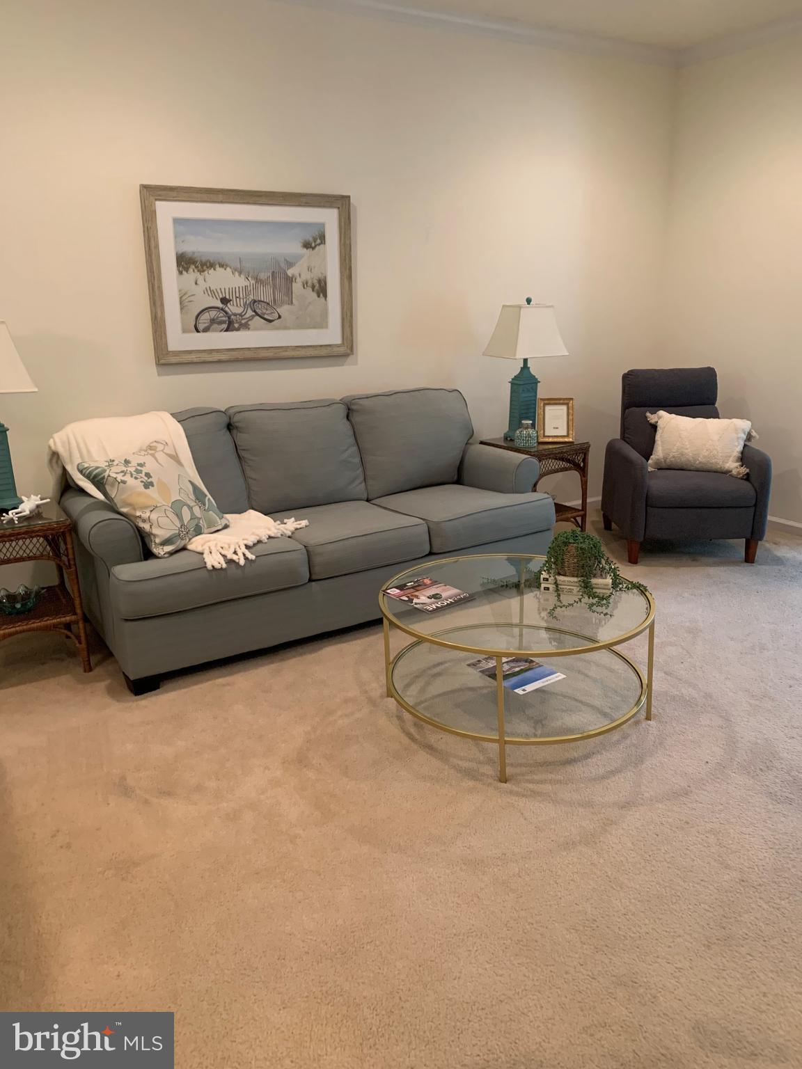 30413 Cedar Neck Road, Unit 304 Ocean View, DE 19970 - Photo 15 of 46 a living room with furniture and a couch