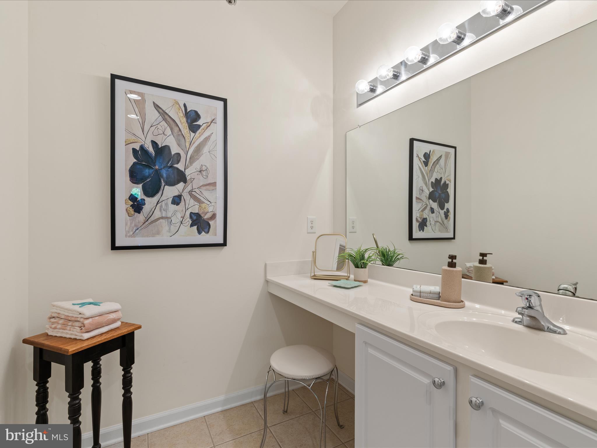 30413 Cedar Neck Road, Unit 304 Ocean View, DE 19970 - Photo 31 of 46 a bathroom with a sink and a mirror