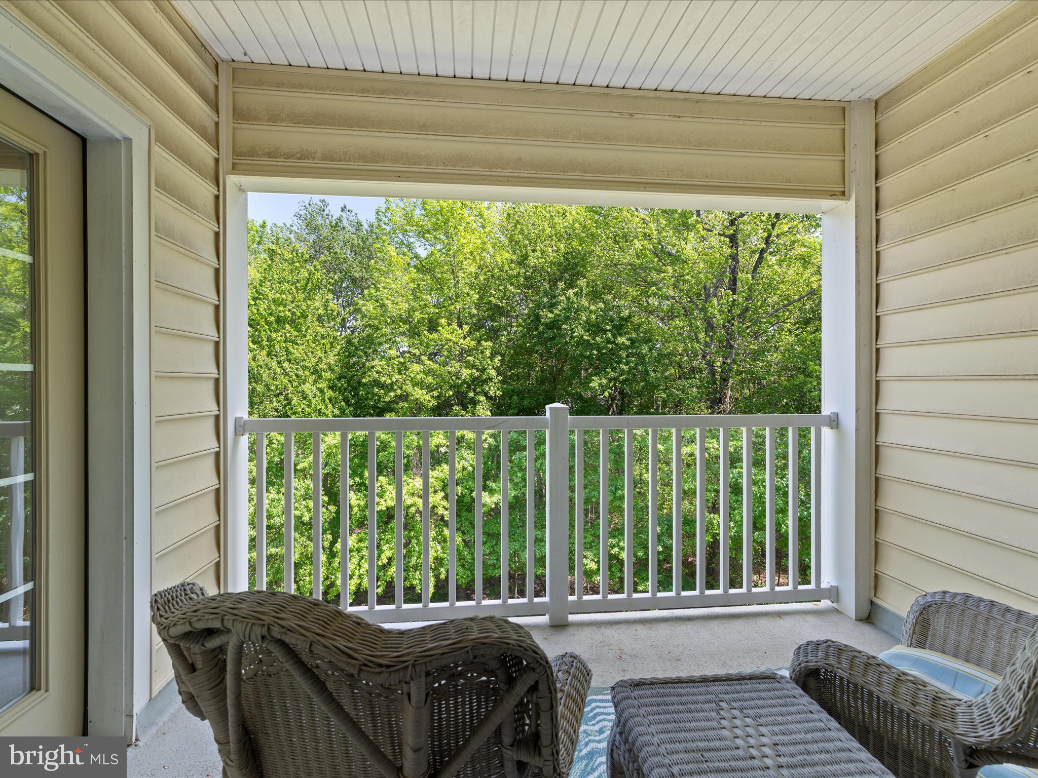 30413 Cedar Neck Road, Unit 304 Ocean View, DE 19970 - Photo 32 of 46 a bedroom with a bed and wooden floor