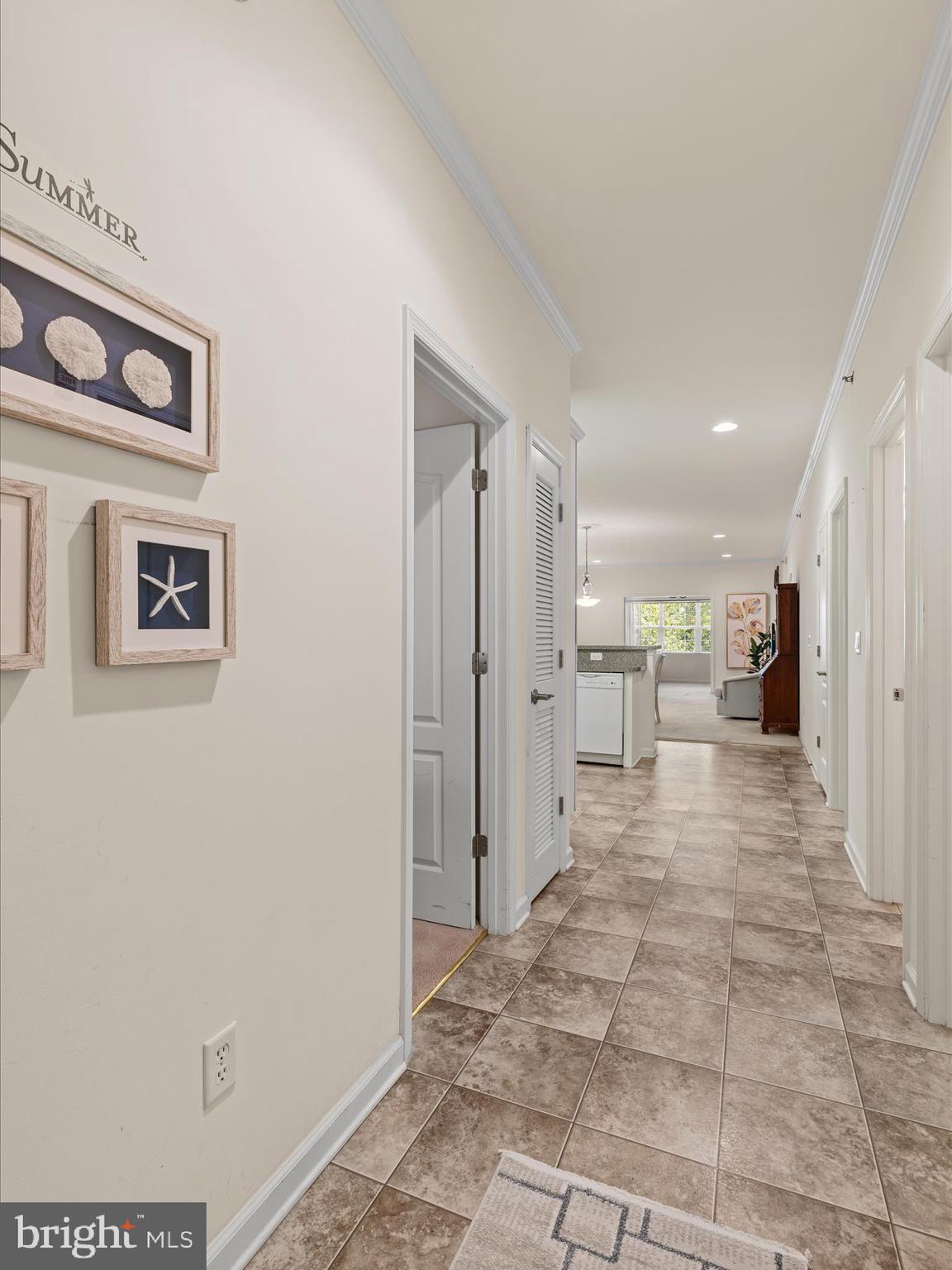 30413 Cedar Neck Road, Unit 304 Ocean View, DE 19970 - Photo 4 of 46 a view of a hallway with a furniture