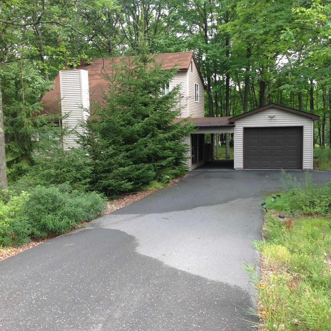222 Maple Ridge Drive Hawley, PA 18428 - Photo 1 of 19 a front view of a house with yard and green space