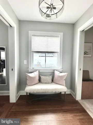 a bathroom with a bathtub shower sink and mirror