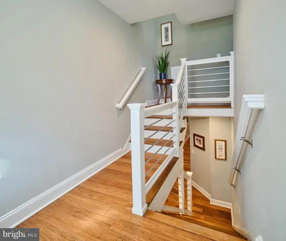 a bathroom with a granite countertop sink mirror and toilet