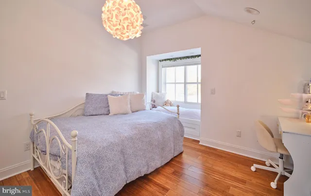 a view of a room with wooden floor and stairs