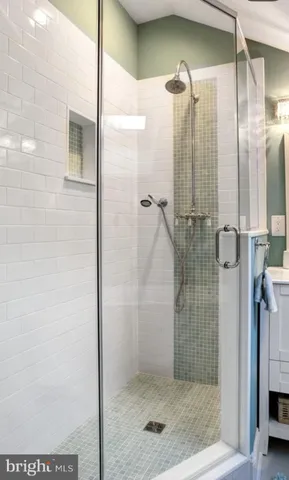 a bathroom with a toilet sink and shower