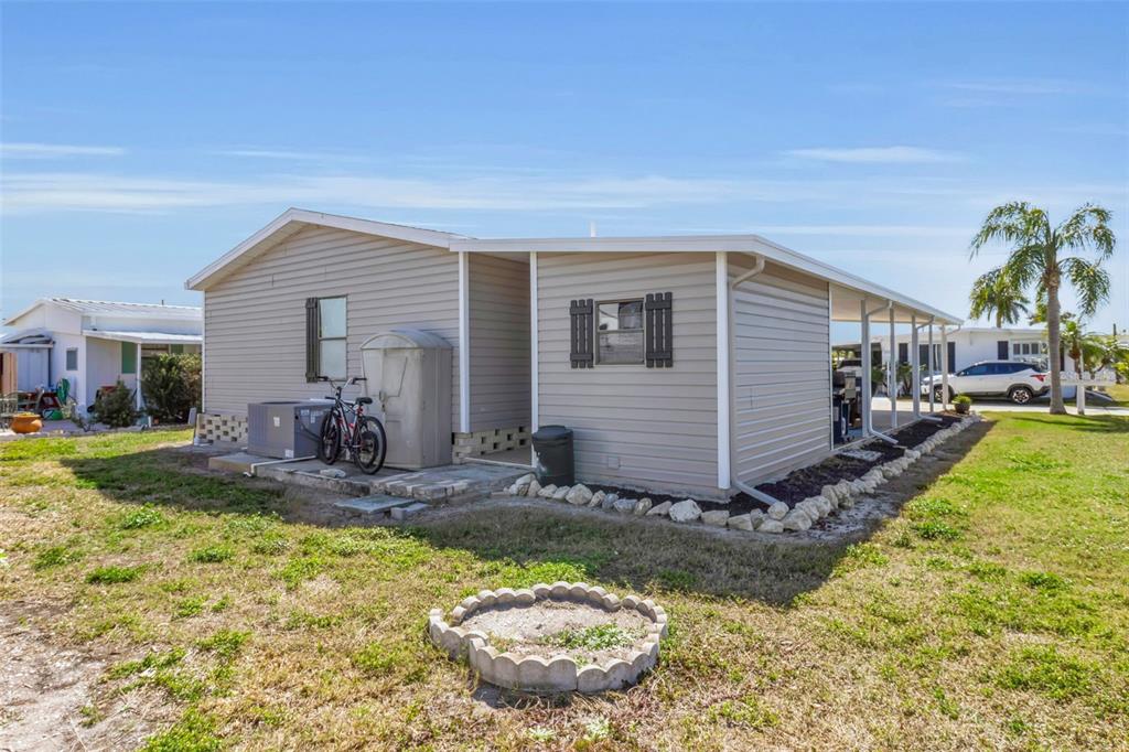 10315 Cortez Road West, Unit 26J Bradenton, FL 34210 - Photo 12 of 69 a view of a house with backyard and sitting area