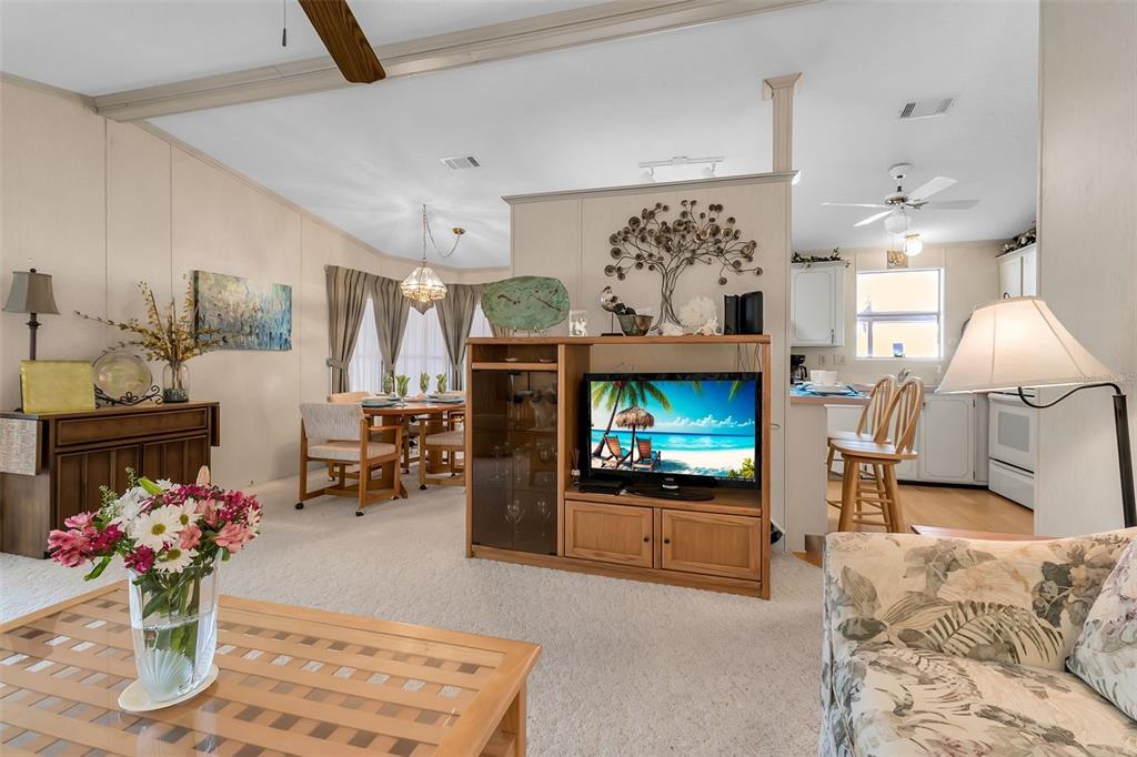10315 Cortez Road West, Unit 26J Bradenton, FL 34210 - Photo 20 of 69 a living room with furniture and a fireplace