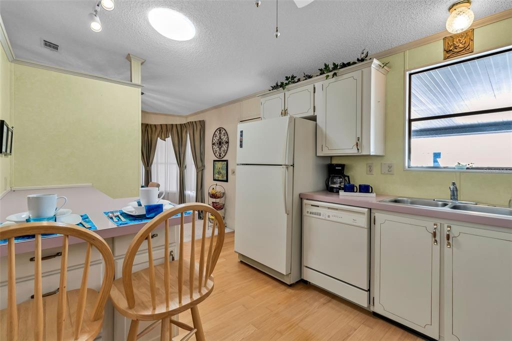 10315 Cortez Road West, Unit 26J Bradenton, FL 34210 - Photo 2 of 69 a kitchen with stainless steel appliances a refrigerator sink and cabinets