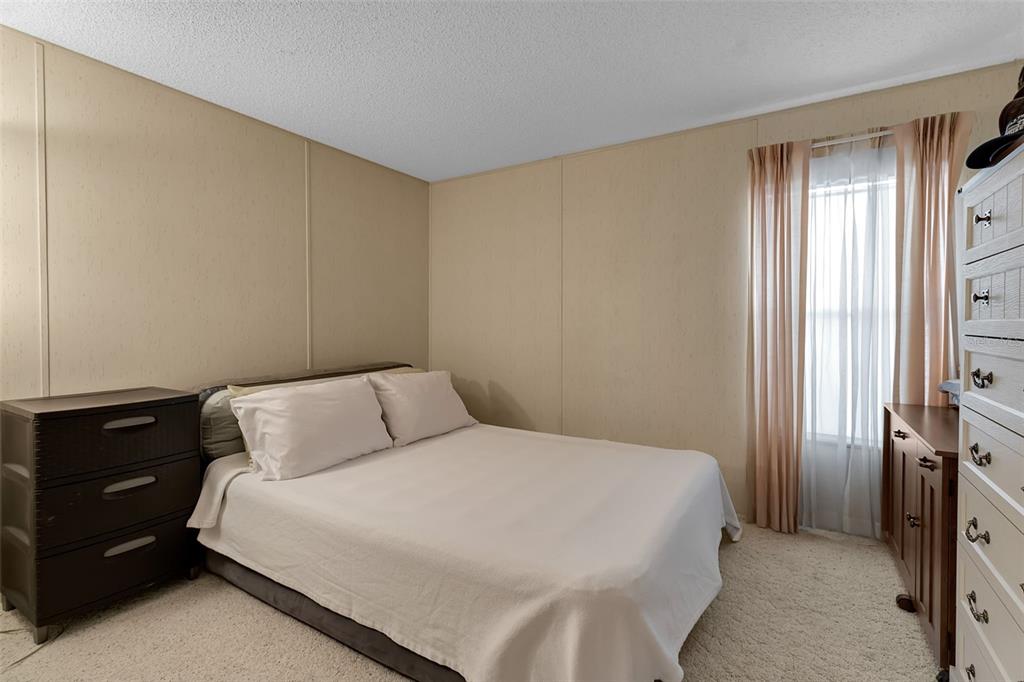 10315 Cortez Road West, Unit 26J Bradenton, FL 34210 - Photo 25 of 69 a bedroom with a bed and a closet