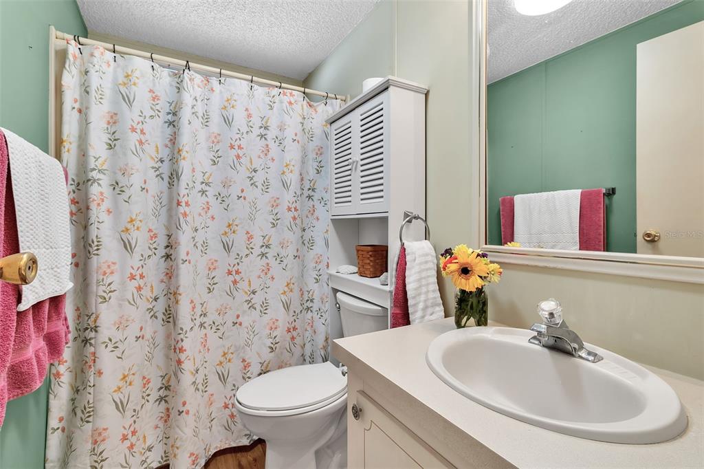 10315 Cortez Road West, Unit 26J Bradenton, FL 34210 - Photo 27 of 69 a bathroom with a sink a toilet and a mirror