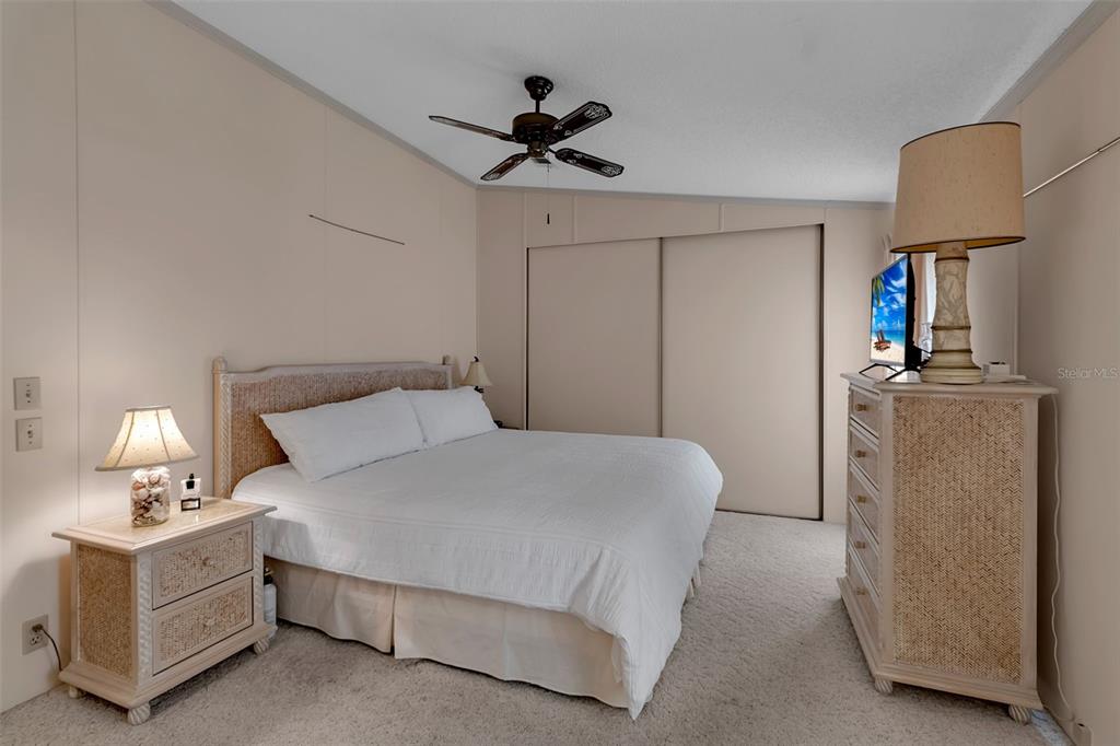 10315 Cortez Road West, Unit 26J Bradenton, FL 34210 - Photo 29 of 69 a bedroom with a bed and a lamp