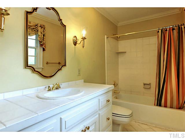817 Lassiter Place Raleigh, NC 27609 - Photo 20 of 24 a bathroom with a sink toilet and shower