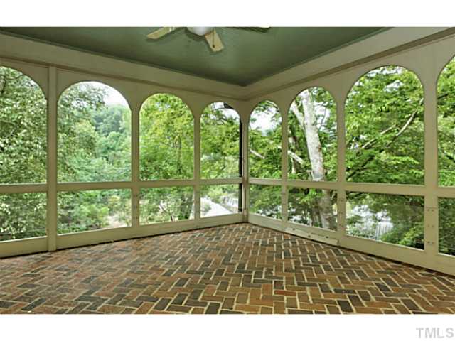817 Lassiter Place Raleigh, NC 27609 - Photo 4 of 24 a view of an empty room with large windows