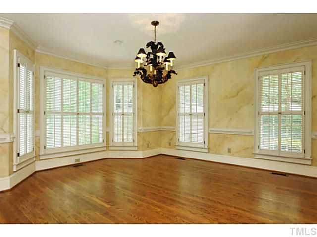 817 Lassiter Place Raleigh, NC 27609 - Photo 8 of 24 a view of an empty room with a window