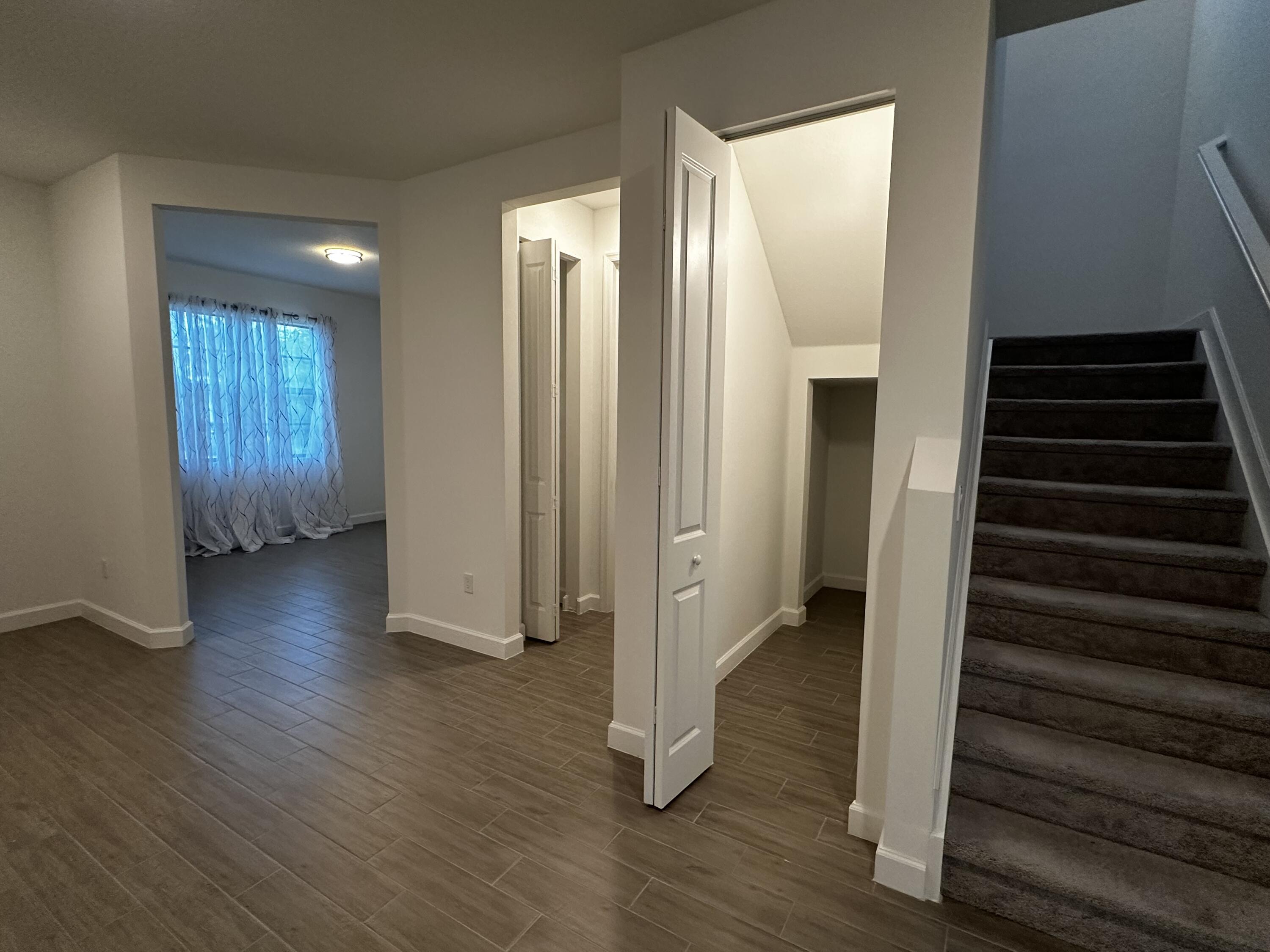 3507 Bauer Road Royal Palm Beach, FL 33411 - Photo 11 of 26 a view of a hallway with wooden floor and stairs