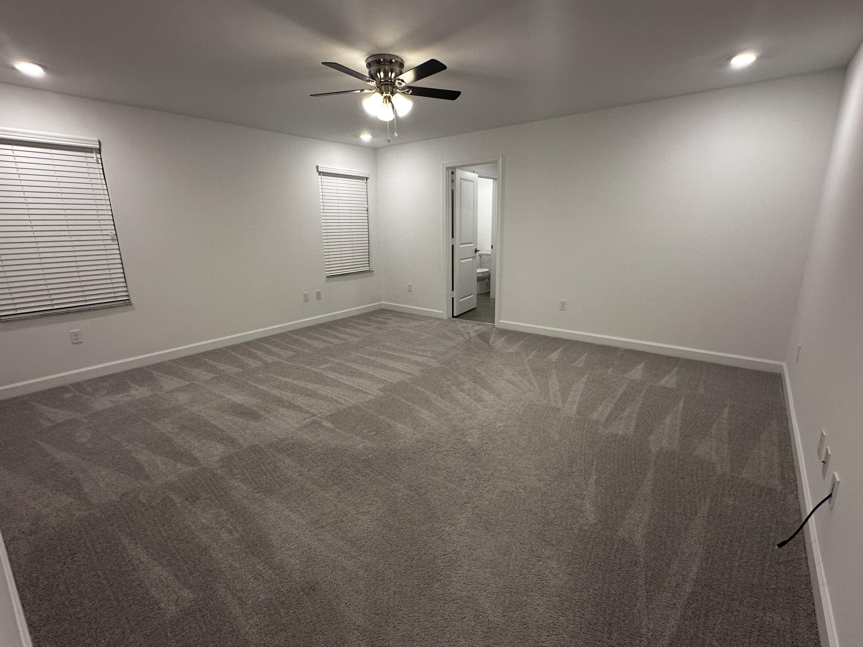 3507 Bauer Road Royal Palm Beach, FL 33411 - Photo 14 of 26 an empty room with fan
