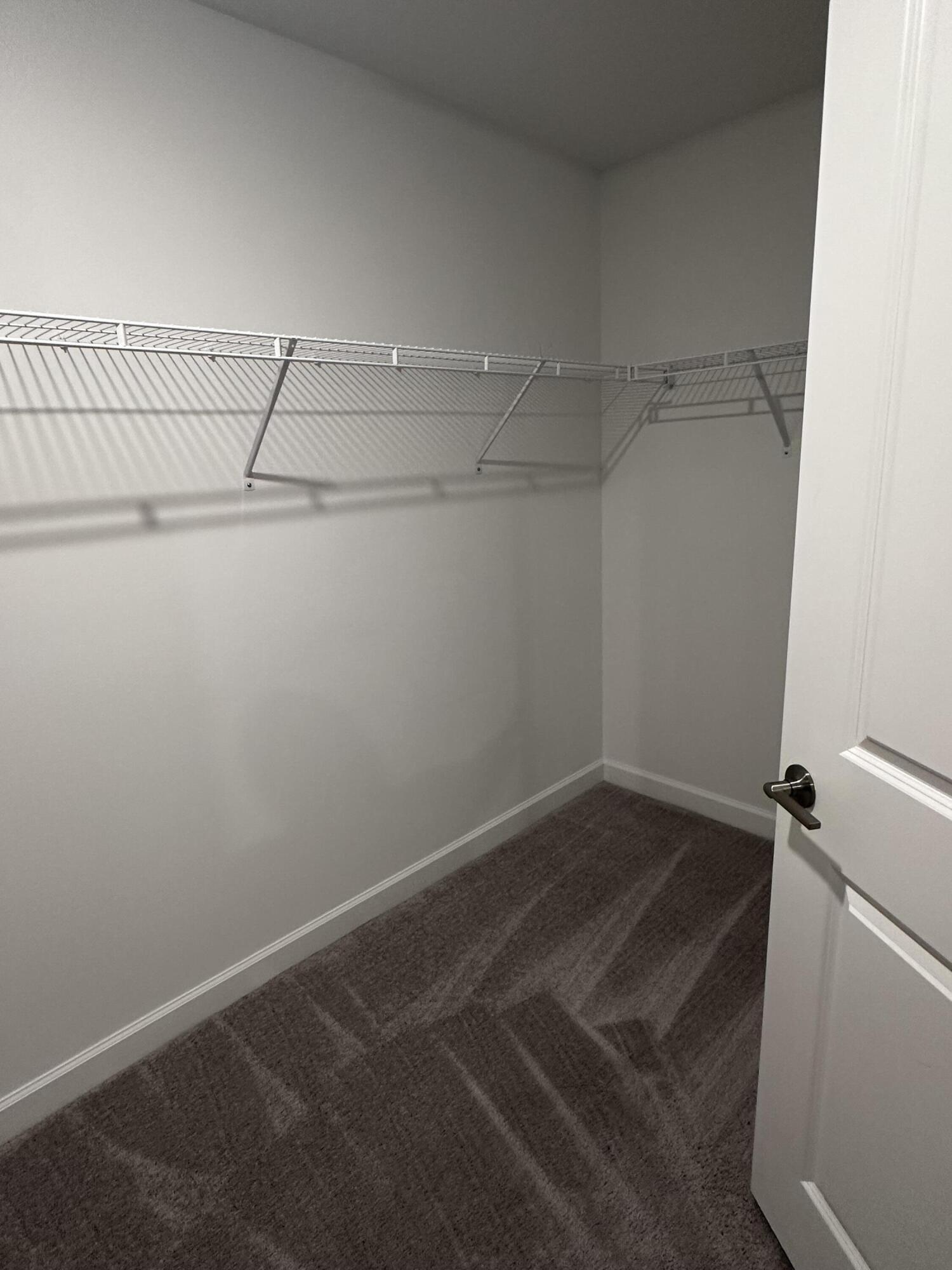 3507 Bauer Road Royal Palm Beach, FL 33411 - Photo 15 of 26 a view of a room with racks on the wall