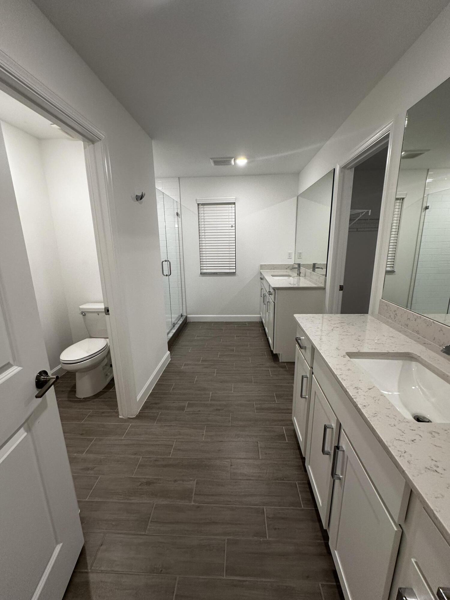 3507 Bauer Road Royal Palm Beach, FL 33411 - Photo 16 of 26 a bathroom with sink and mirror