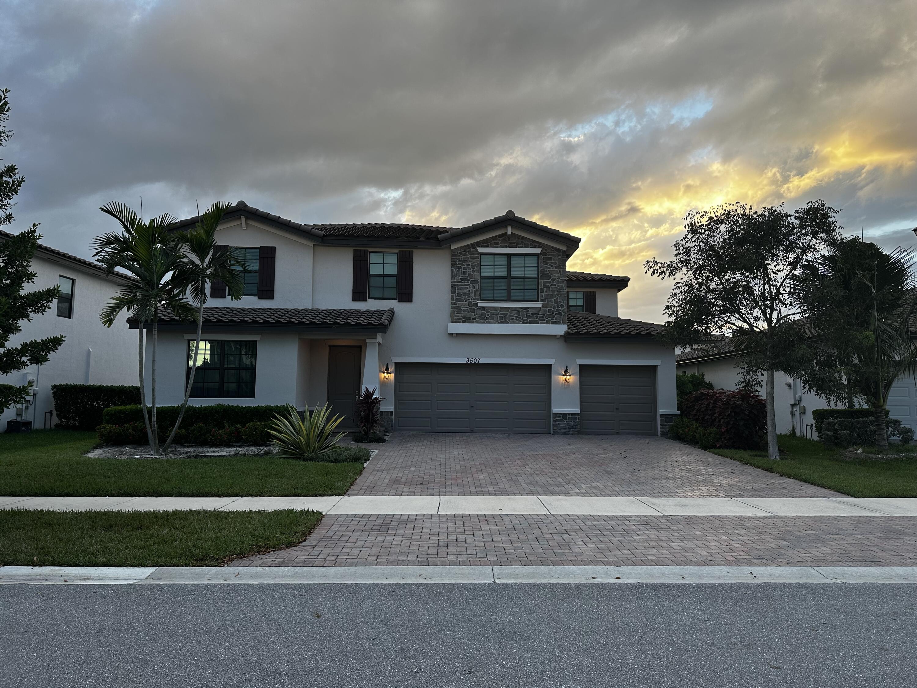 3507 Bauer Road Royal Palm Beach, FL 33411 - Photo 2 of 26 a front view of a house with a yard