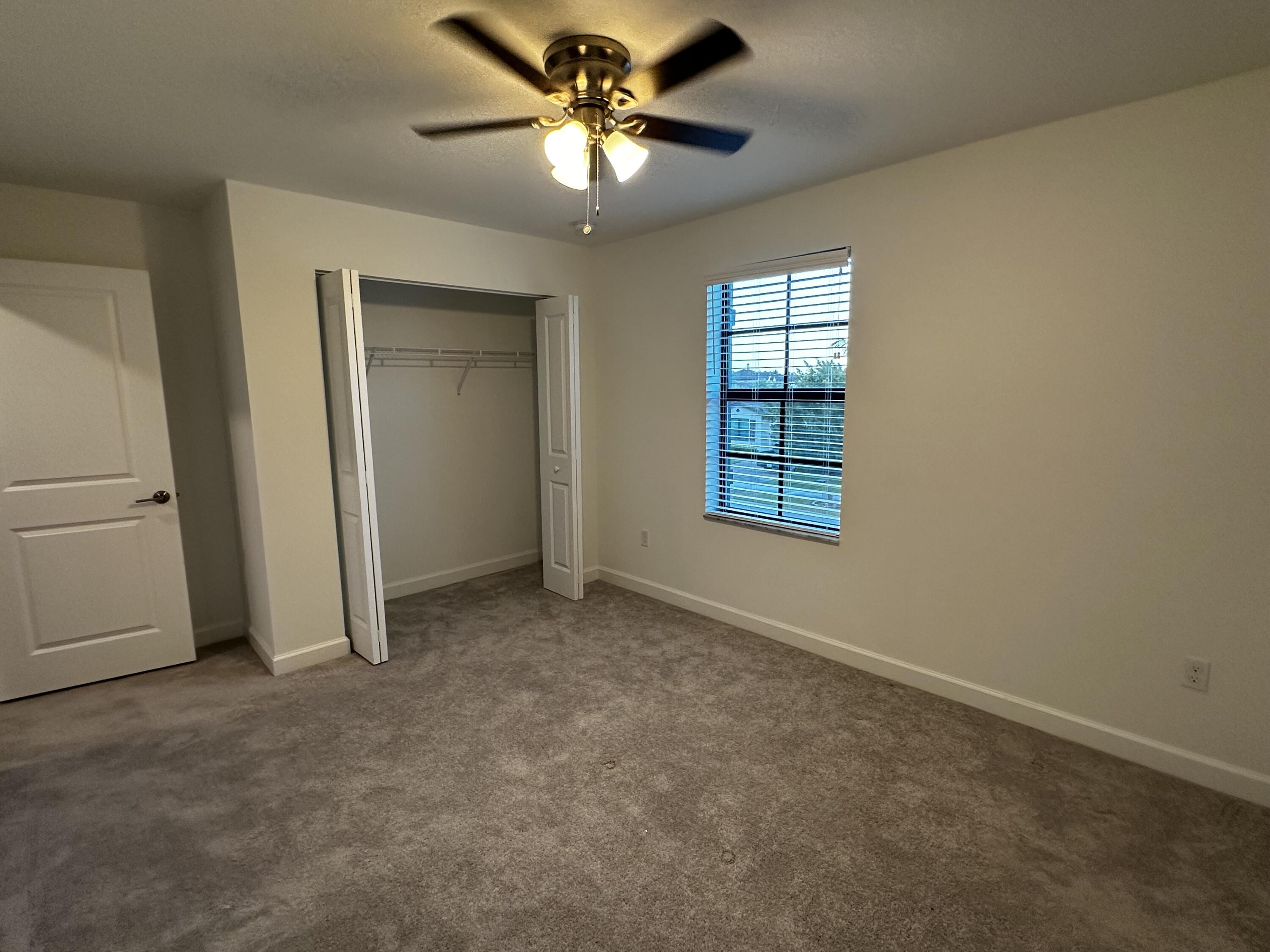 3507 Bauer Road Royal Palm Beach, FL 33411 - Photo 21 of 26 an empty room with windows and fan