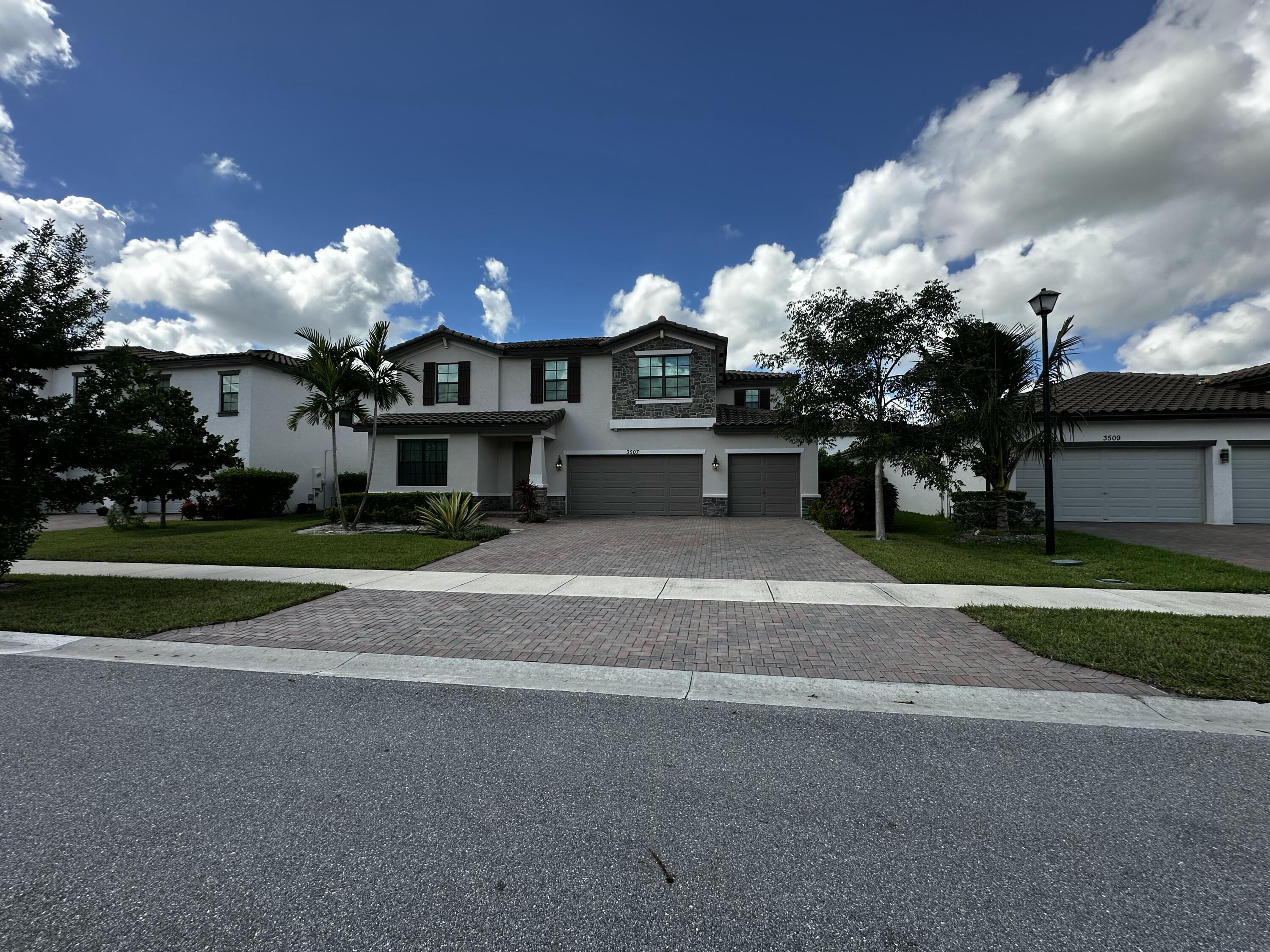 3507 Bauer Road Royal Palm Beach, FL 33411 - Photo 3 of 26 a front view of a house with a yard