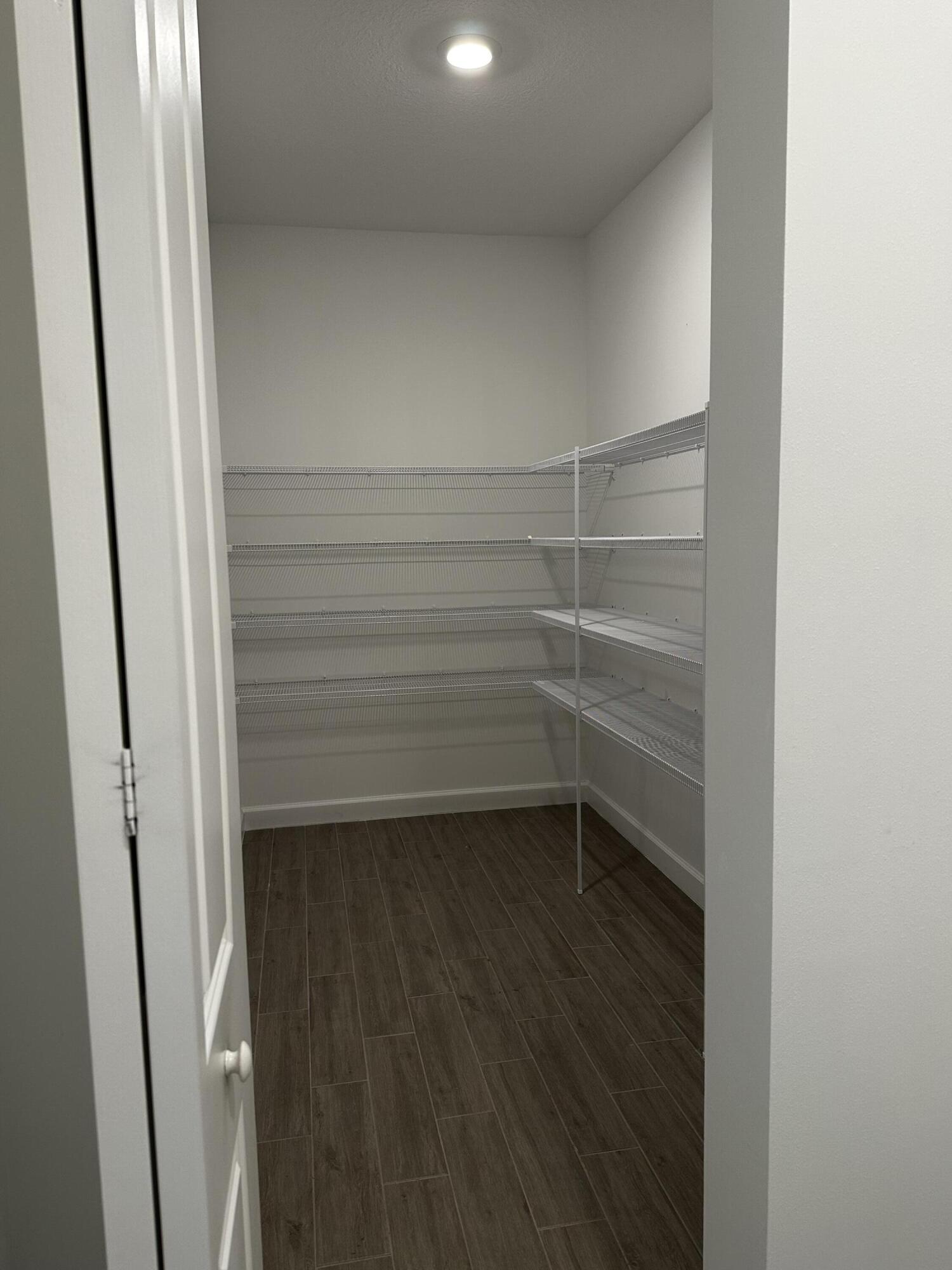 3507 Bauer Road Royal Palm Beach, FL 33411 - Photo 9 of 26 a view of walk in closet with empty racks