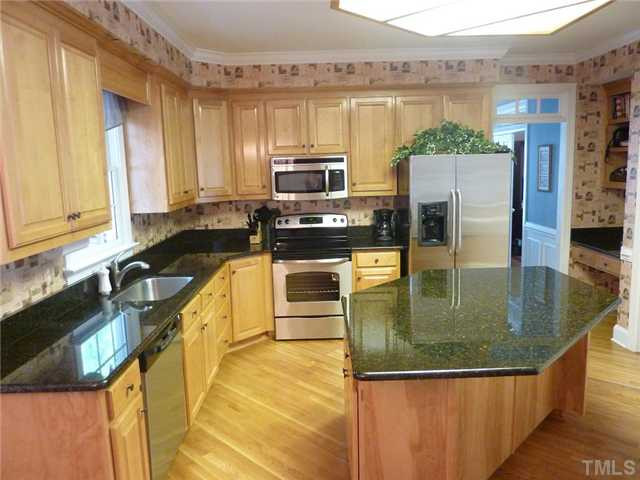 9405 Stone Mountain Road Raleigh, NC 27613 - Photo 3 of 12 Spacious kitchen with granite counter-tops, large center island, pantry and hardwood floors. NEW stainless appliances!!
