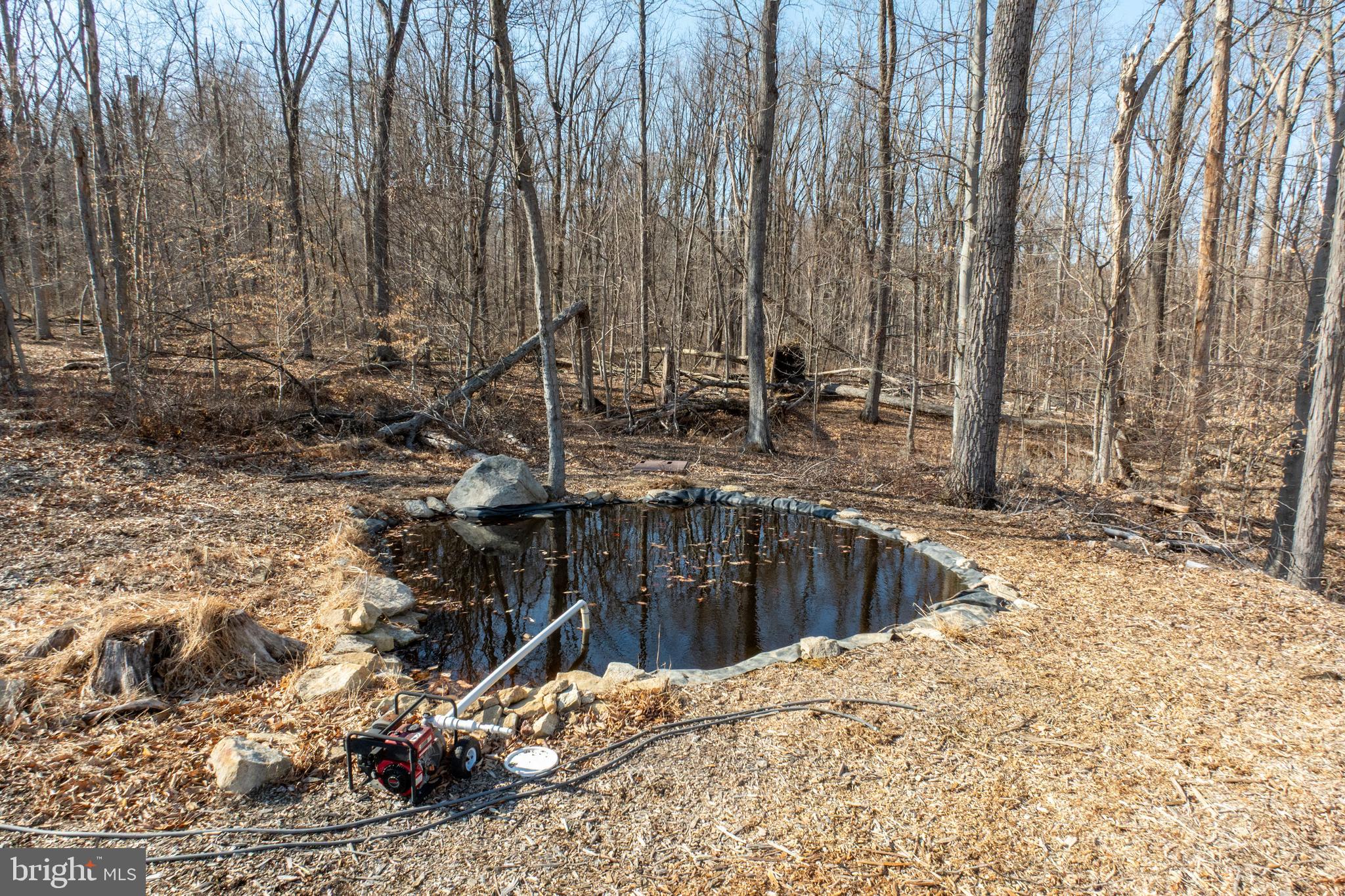 334 Forgedale Road Barto, PA 19504 - Photo 13 of 22 a view of swimming pool with lawn chairs and wooden fence