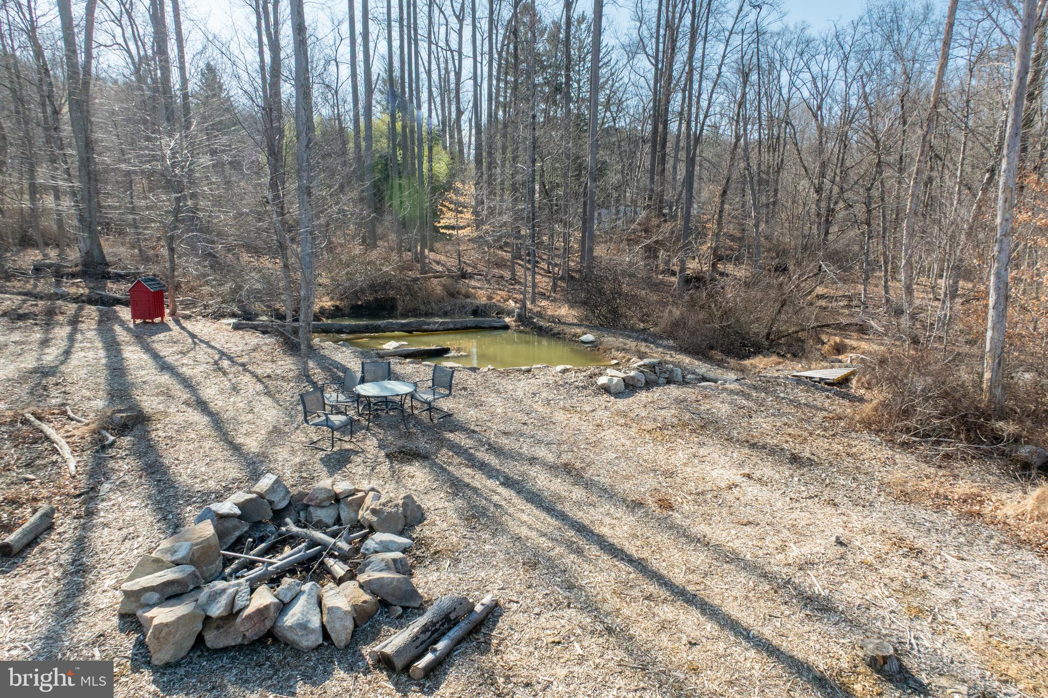 334 Forgedale Road Barto, PA 19504 - Photo 19 of 22 a view of swimming pool with lawn chairs and wooden fence