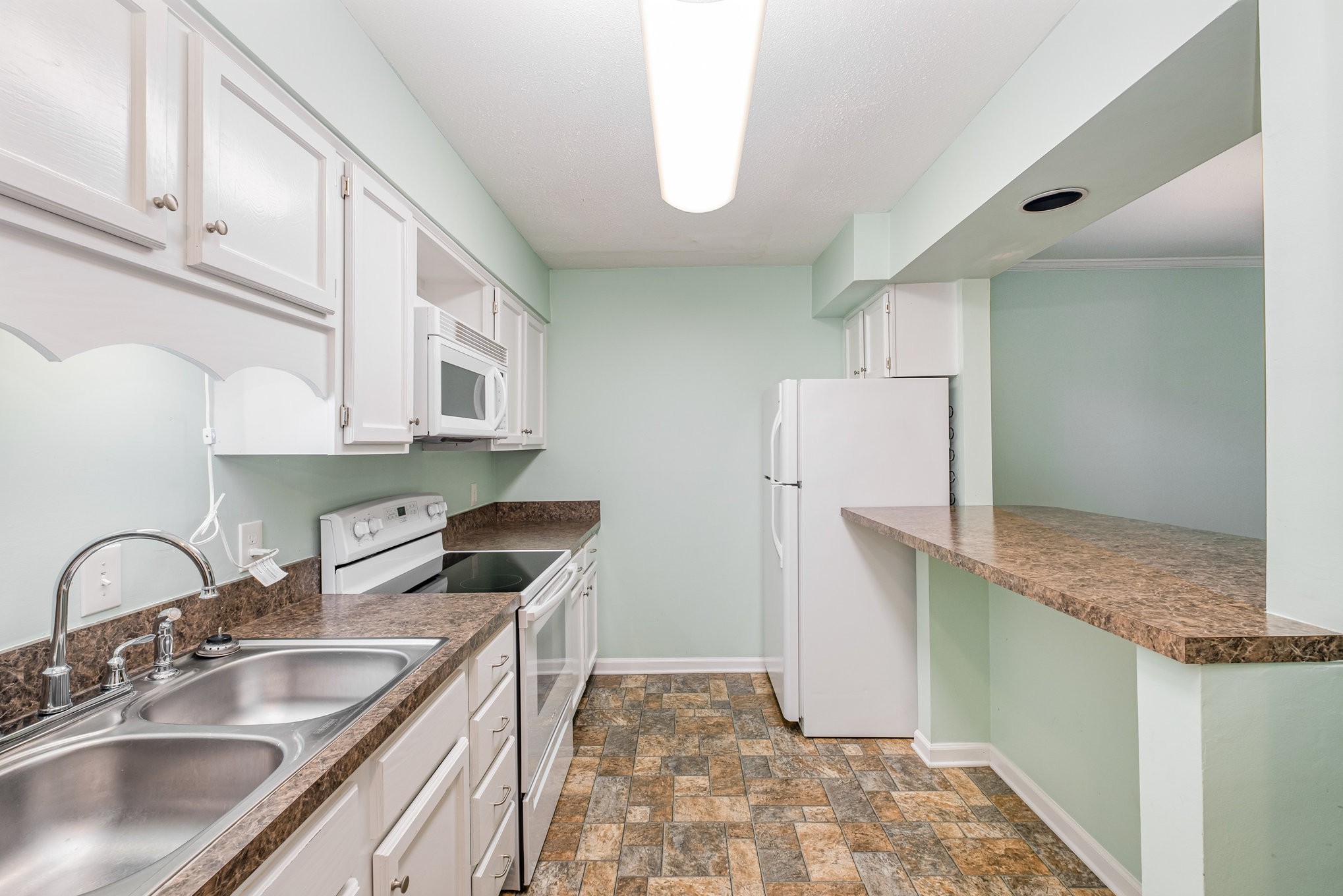 1280 Middle Tennessee Boulevard, Unit F8 Murfreesboro, TN 37130 - Photo 11 of 18 a kitchen with a sink and a refrigerator