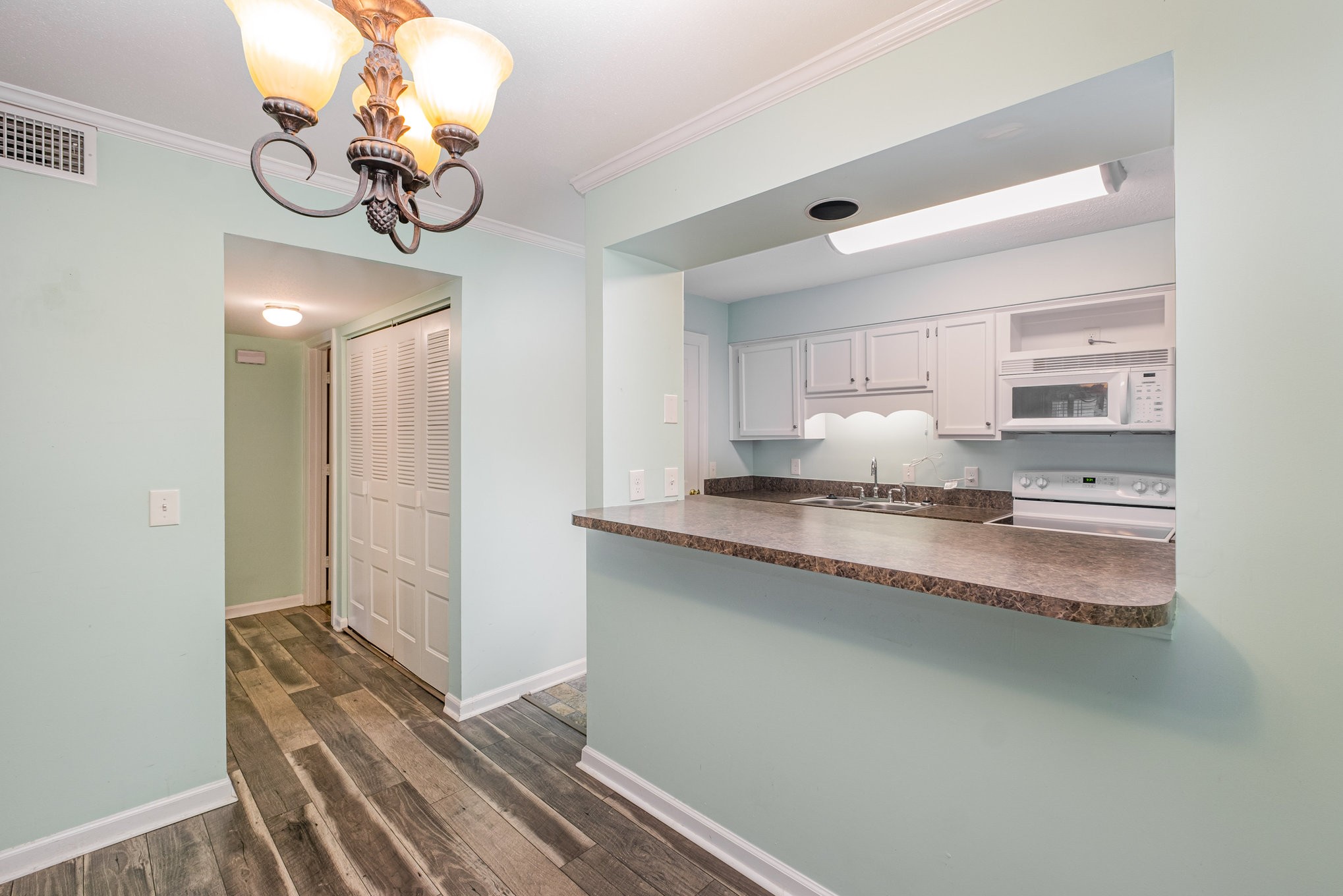 1280 Middle Tennessee Boulevard, Unit F8 Murfreesboro, TN 37130 - Photo 12 of 18 a kitchen with granite countertop white cabinets and stainless steel appliances