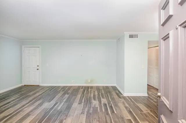 a view of empty room with windows