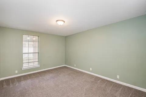 a kitchen with a sink and a stove top oven