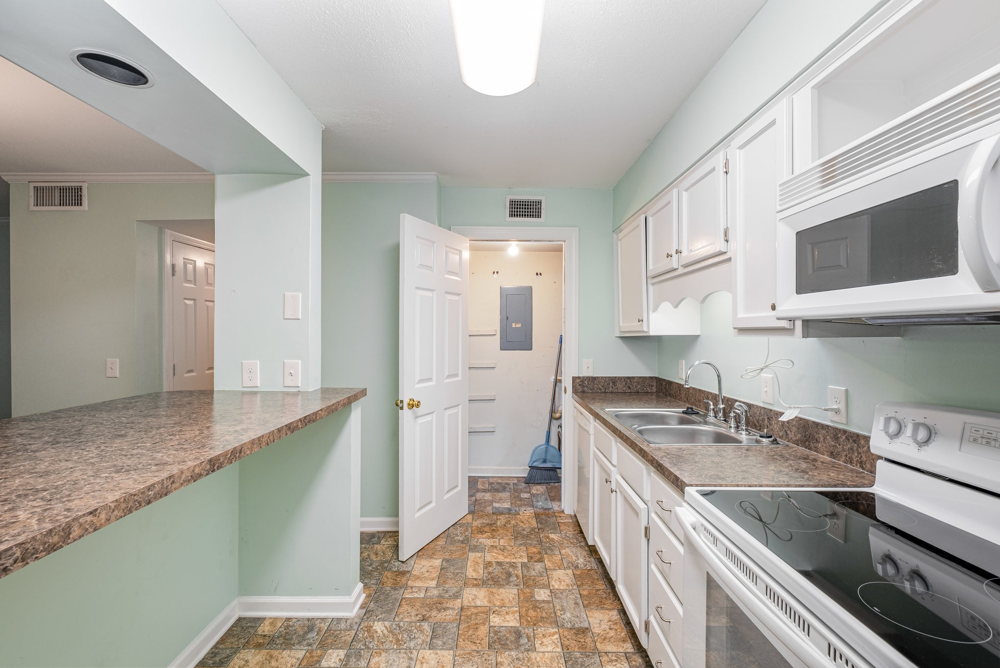 1280 Middle Tennessee Boulevard, Unit F8 Murfreesboro, TN 37130 - Photo 10 of 18 a kitchen with a sink and a stove top oven