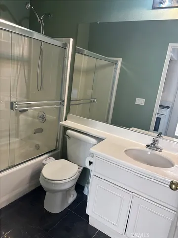 a bathroom with a toilet and a sink