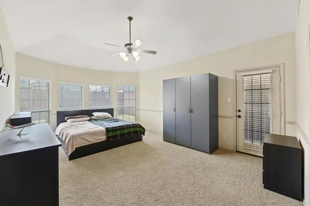 a bedroom with bed and window