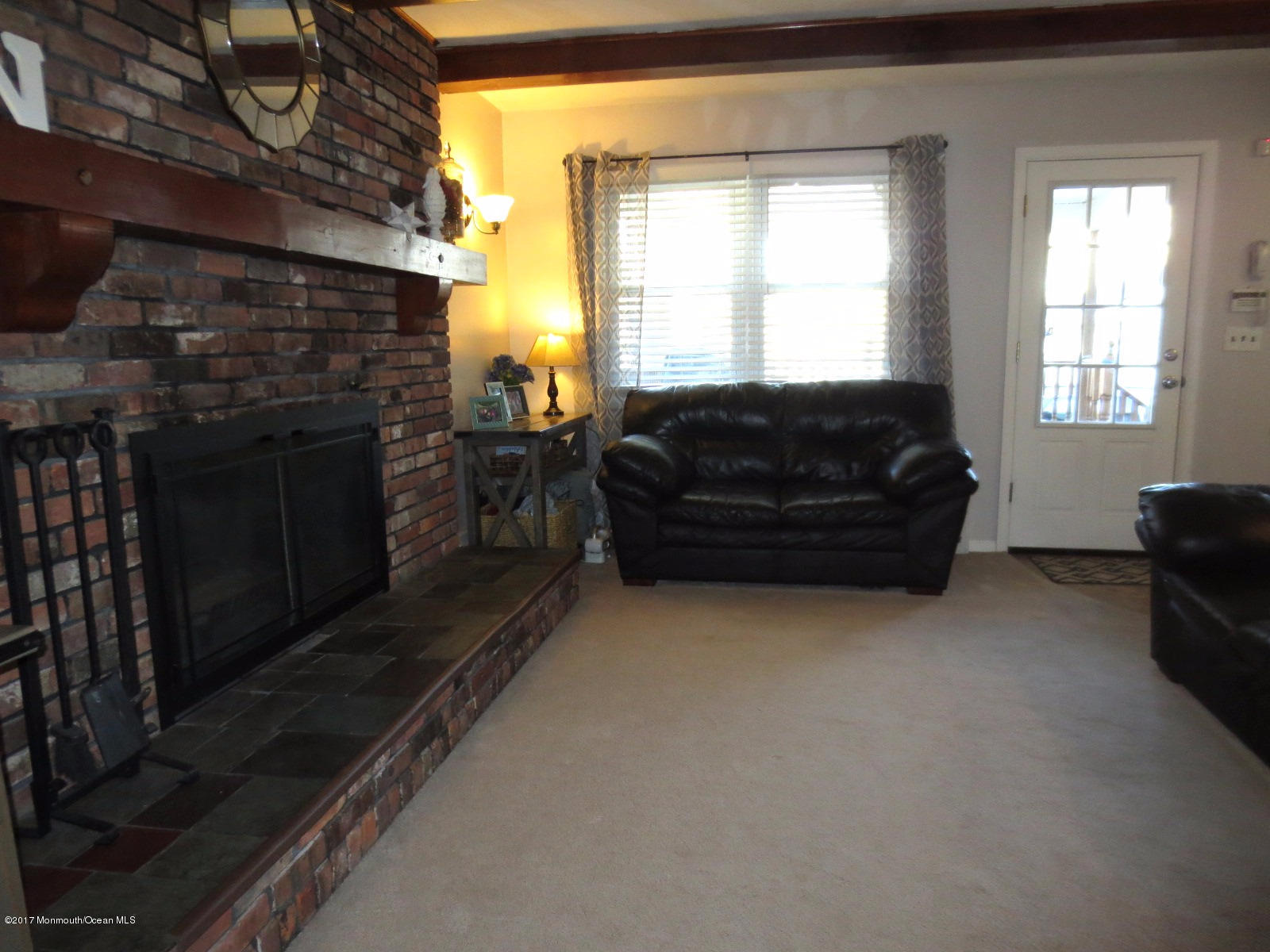 131 Ravine Drive Matawan, NJ 07747 - Photo 11 of 23 a living room with furniture windows and a fireplace