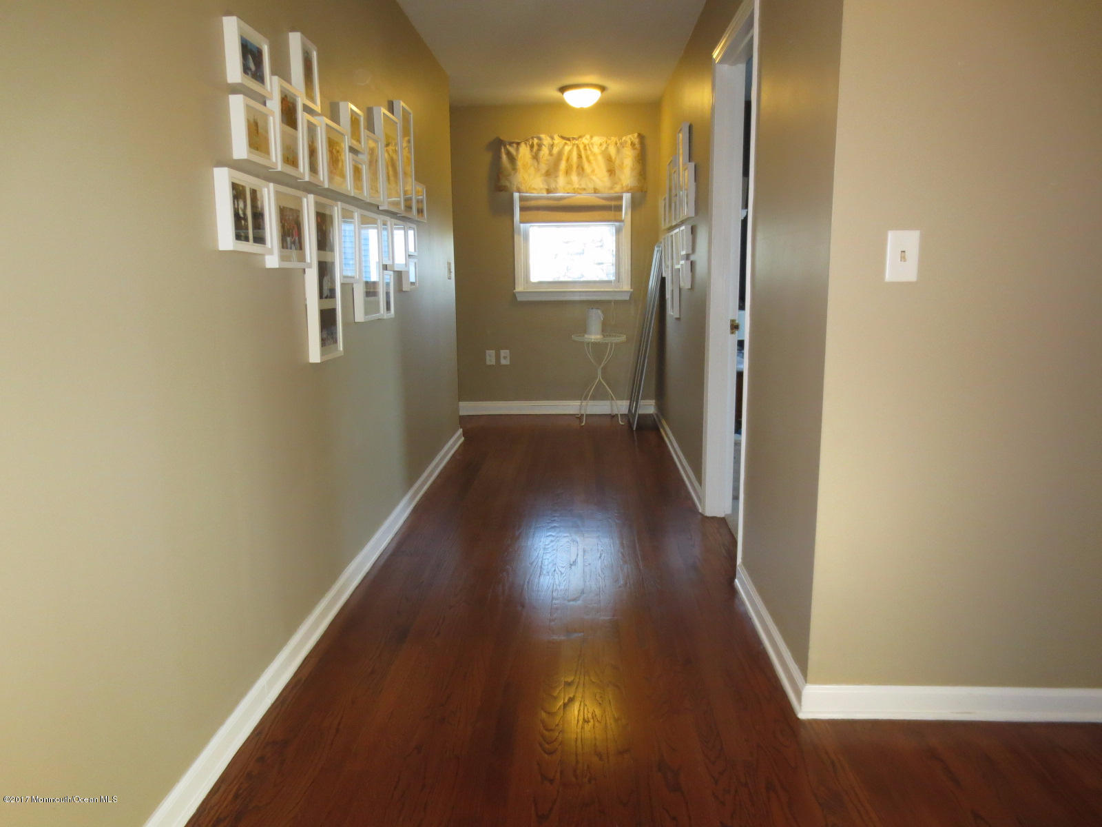 131 Ravine Drive Matawan, NJ 07747 - Photo 13 of 23 a view of a hallway with wooden floor