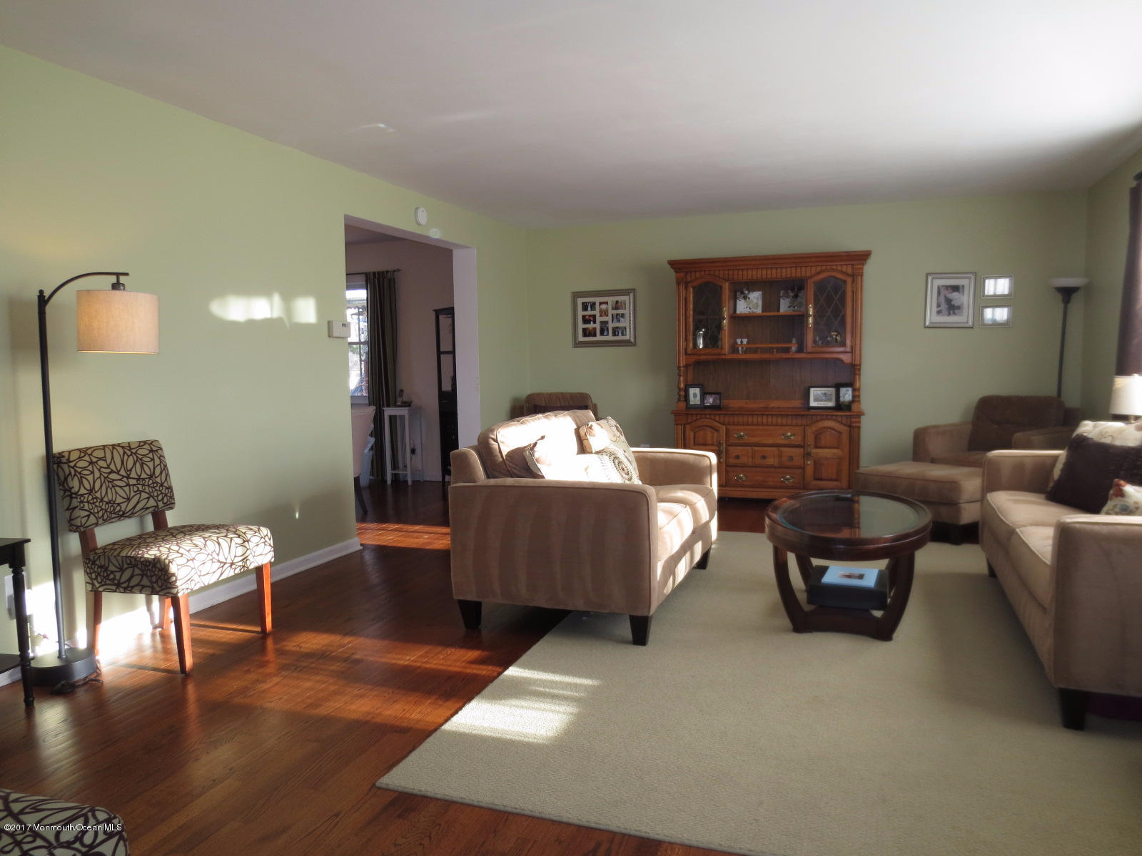 131 Ravine Drive Matawan, NJ 07747 - Photo 2 of 23 a living room with furniture and a wooden floor