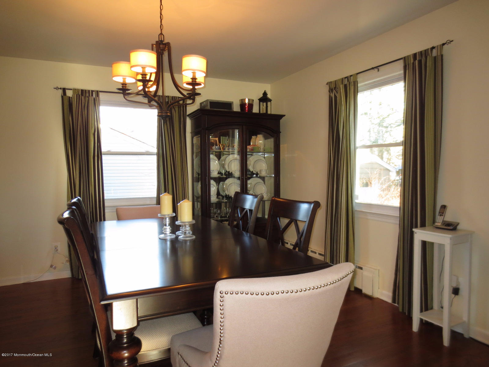 131 Ravine Drive Matawan, NJ 07747 - Photo 4 of 23 a view of a dining room with furniture window and wooden floor