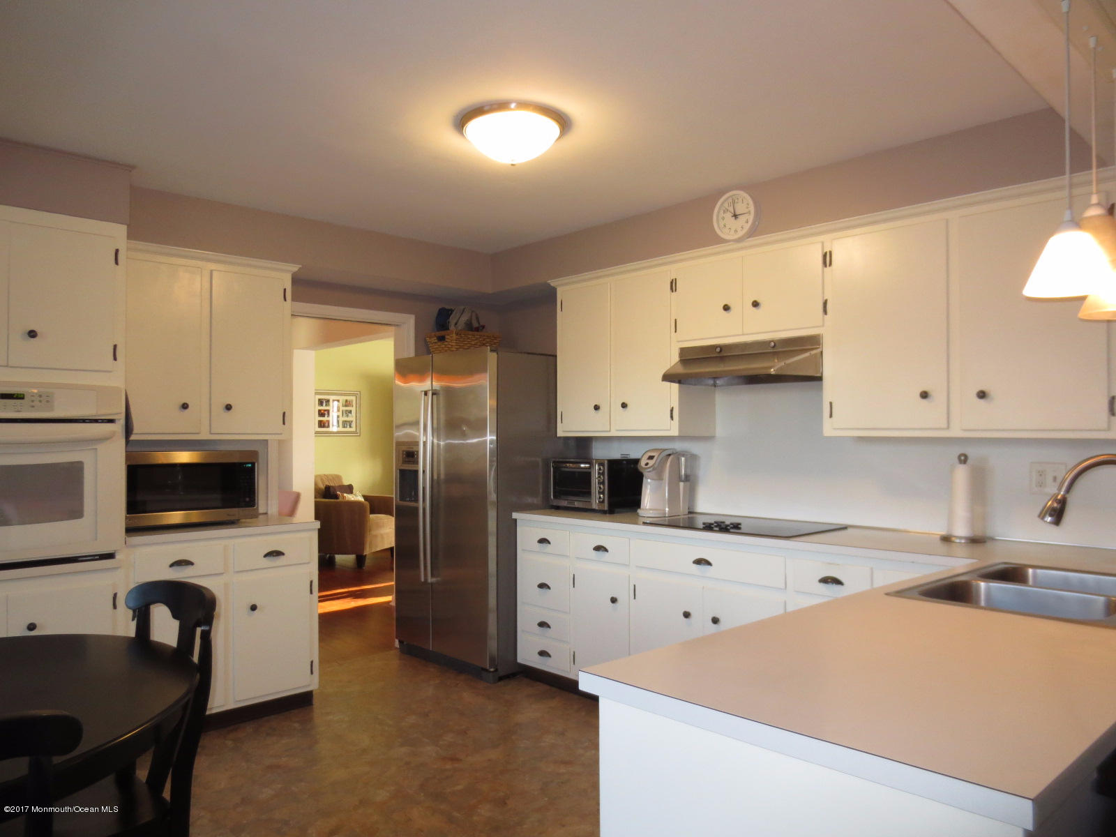 131 Ravine Drive Matawan, NJ 07747 - Photo 6 of 23 a kitchen with stainless steel appliances a refrigerator sink and cabinets